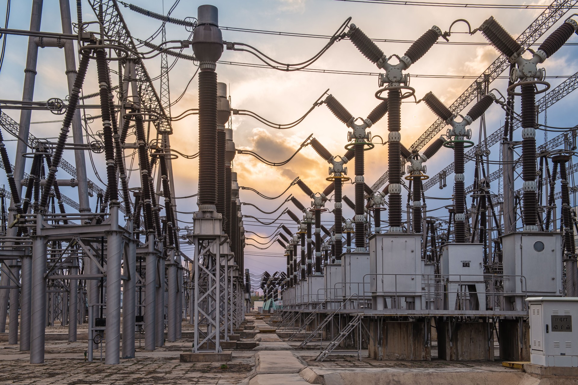 Delivery of electricity. High-voltage substation with power line and Insulator